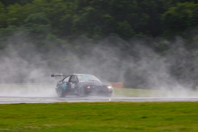 Car on VIR racetrack with fog lifting from the ground